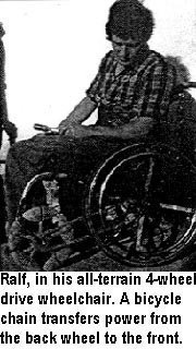 Ralf, in his all-terrain 4-wheel drive wheelchair. A bicycle chain transfers power from the back wheel to the front.