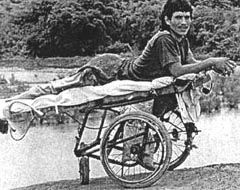 PROJIMO staff built a wheeled cot, or gurney, so that he could be active while lying on his stomach, and so his sores (on his backside) would heal.
