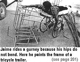 Jaime rides a gurney because his hips do not bend. Here he paints the frame of a tricycle trailer (see page 201).
