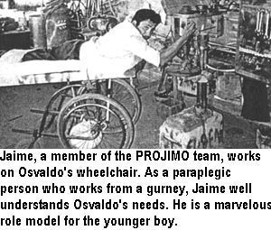 Jaime, a member of the PROJIMO team, works on Osvaldo's wheelchair. As a paraplegic person who works from a gurney, Jaime well understands Osvaldo's needs. He is a marvelous role model for the younger boy.