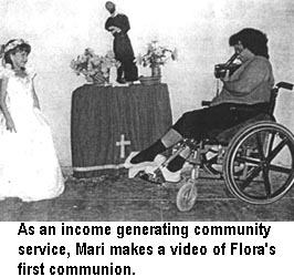 As an income generating community service, Mari makes a video of Flora's first communion.
