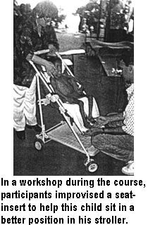 In a workshop during the course, participants improvised a seat-insert to help this child sit in a better position in his stroller.